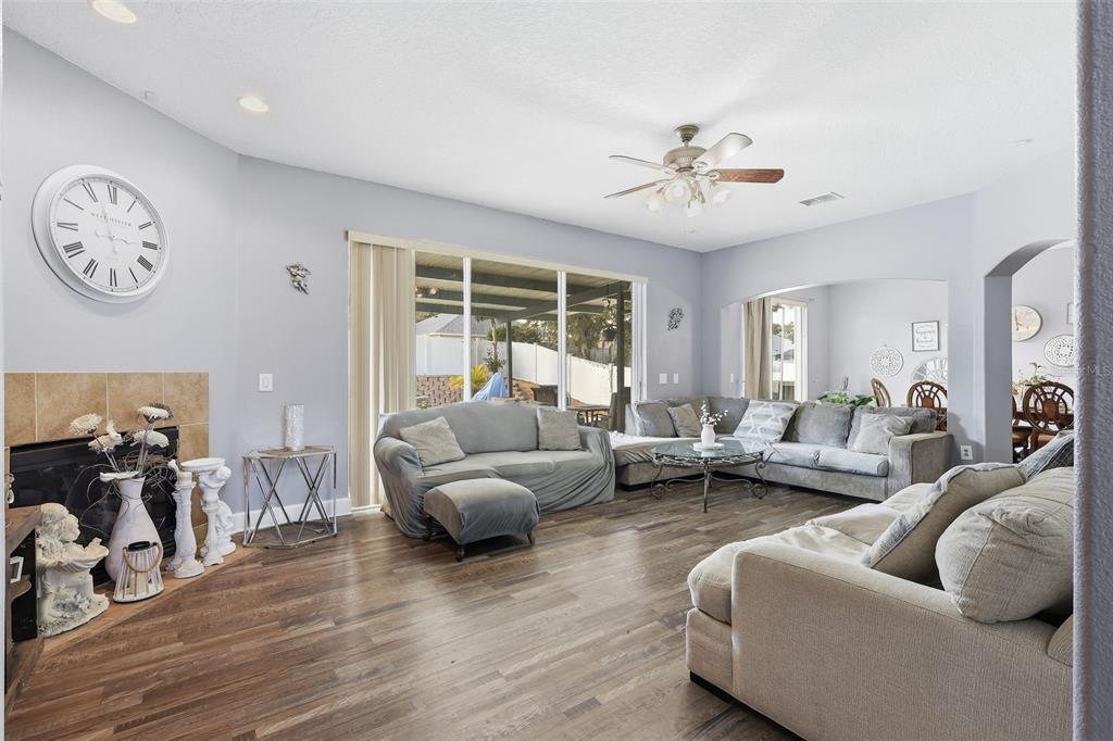 5047 Rishley Run Way Mount Dora, FL 32757 - Photo 7 of 42 a living room with furniture and a large window