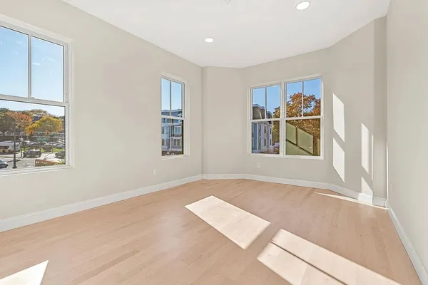 a view of an empty room with a window