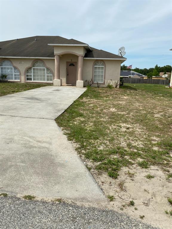 703 Bittern Way, Unit B Kissimmee, FL 34759 - Photo 1 of 1 a view of house with yard and ocean view