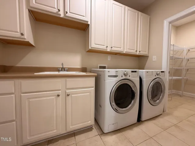 an empty room with fan and windows