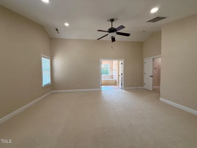 a bathroom with a bathtub and a window