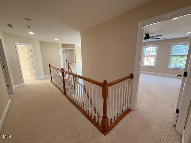 a bathroom with a toilet a sink and a mirror