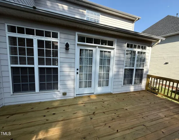 a view of balcony with wooden floor