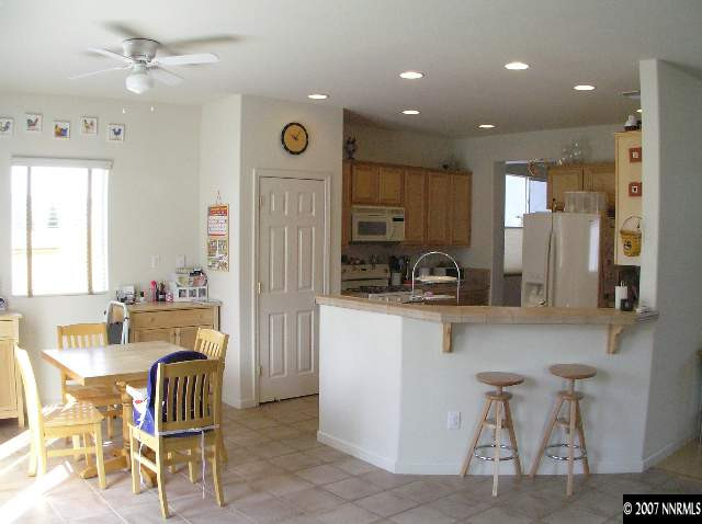 10430 Gold Arrow Drive Reno, NV 89521 - Photo 4 of 9 a dining room with furniture and window