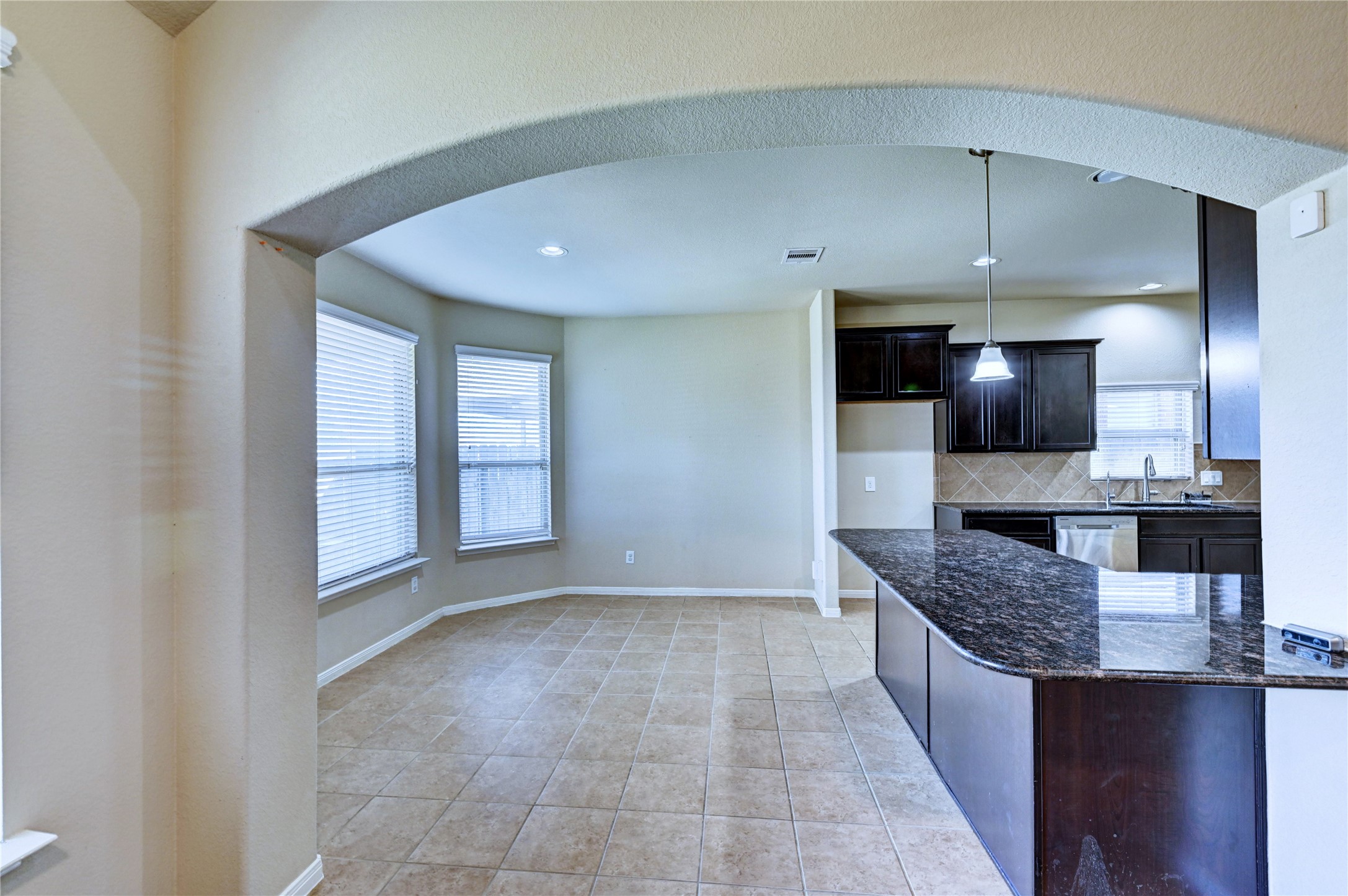 2619 Colony Haven Circle Spring, TX 77373 - Photo 19 of 50 a view of living room with kitchen island granite countertop furniture and flat screen tv