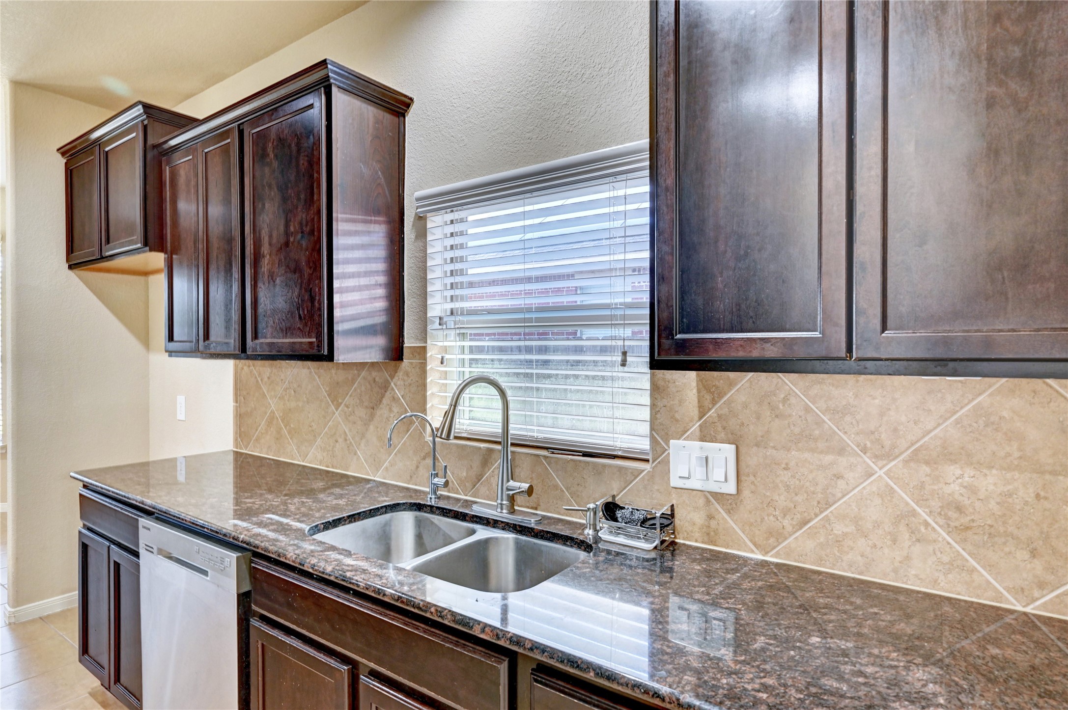 2619 Colony Haven Circle Spring, TX 77373 - Photo 28 of 50 a kitchen with stainless steel appliances granite countertop a sink and cabinets