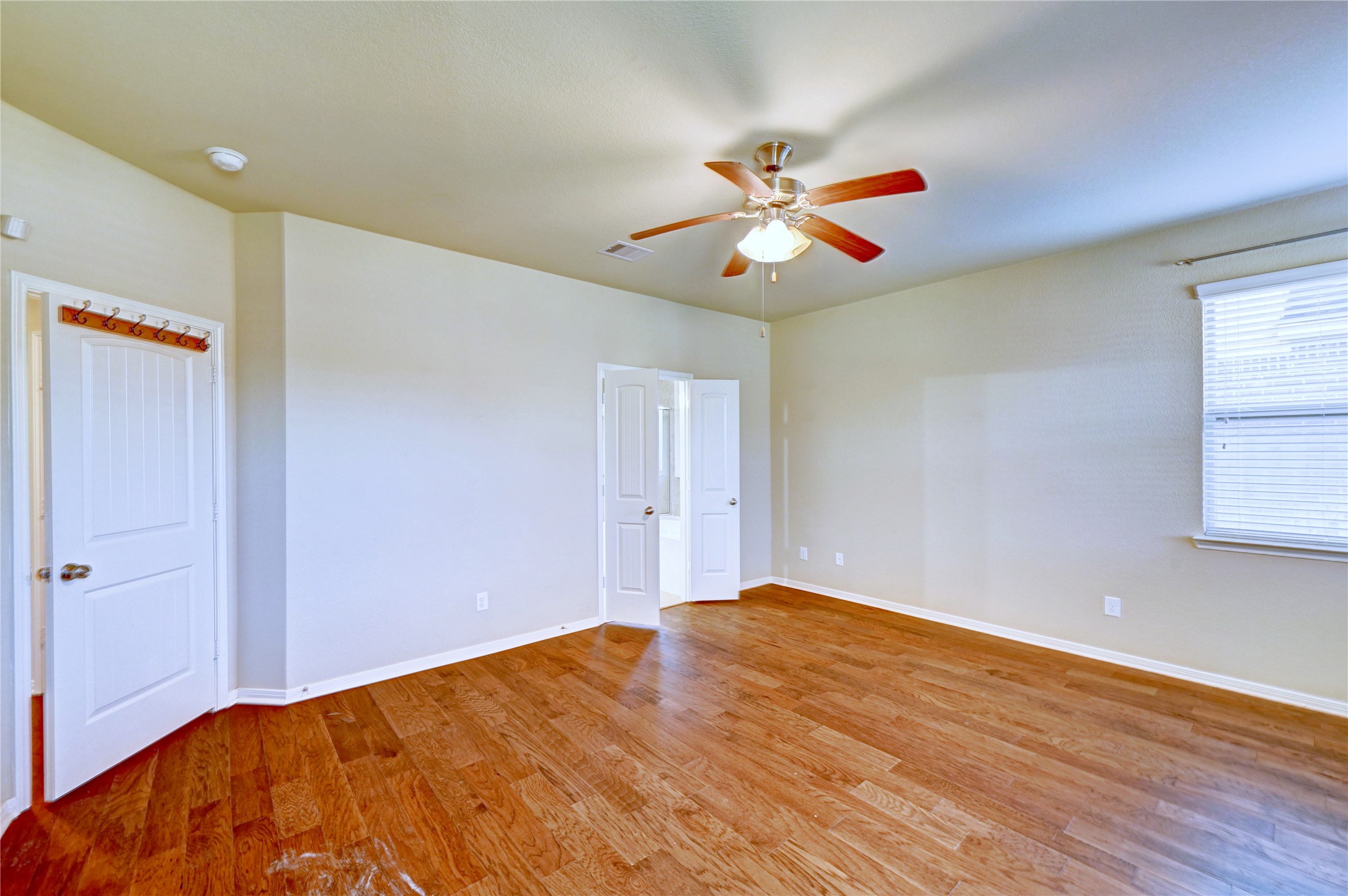 2619 Colony Haven Circle Spring, TX 77373 - Photo 33 of 50 a bedroom with a bed and a chandelier