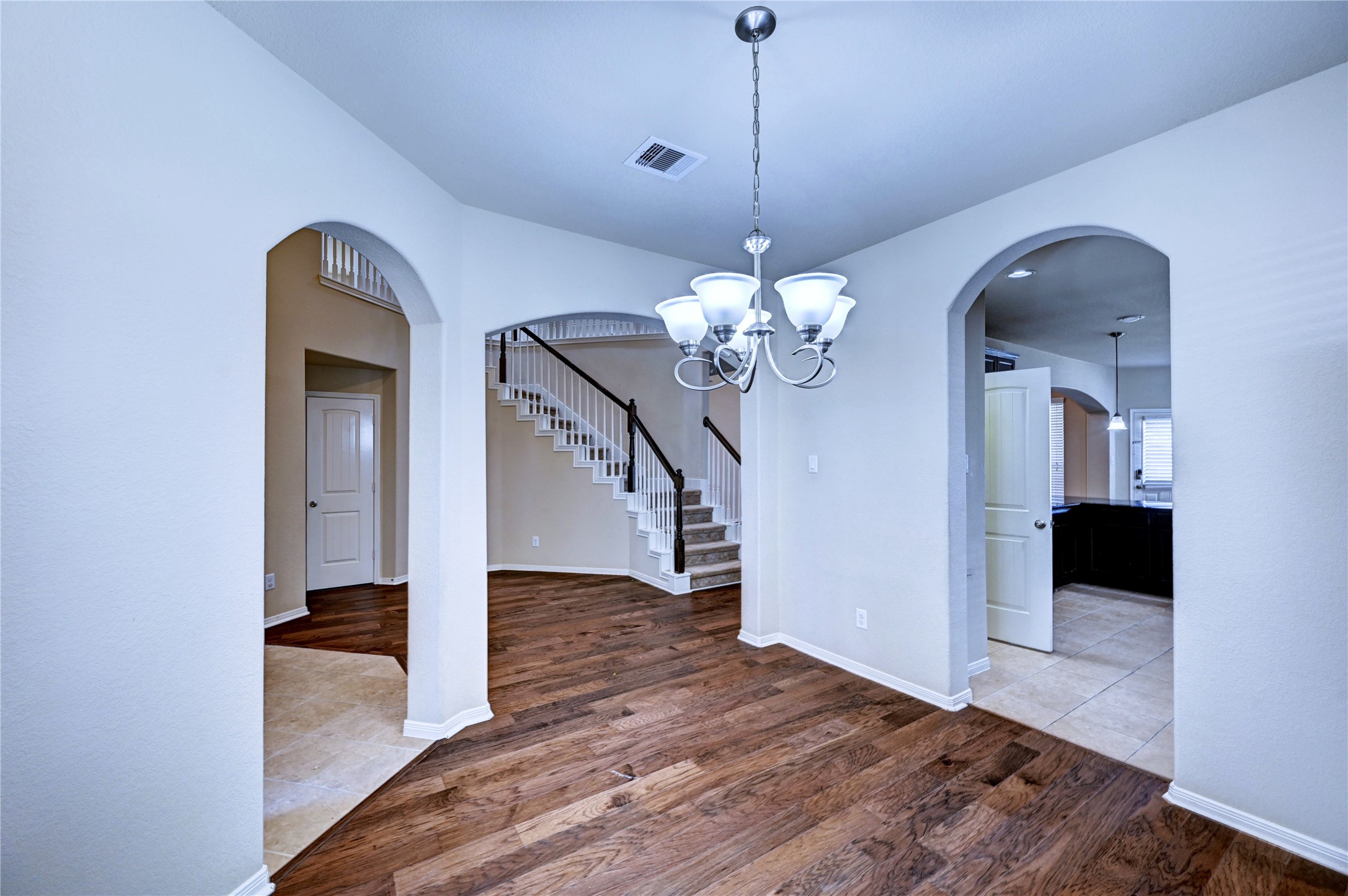 2619 Colony Haven Circle Spring, TX 77373 - Photo 10 of 50 a view of a hallway with wooden floor and staircase