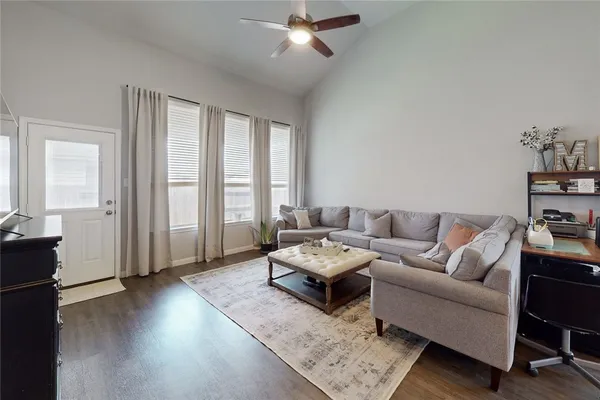 a living room with furniture and a window