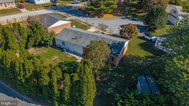 an aerial view of houses with yard