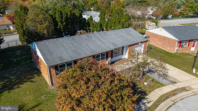 an aerial view of a house having yard