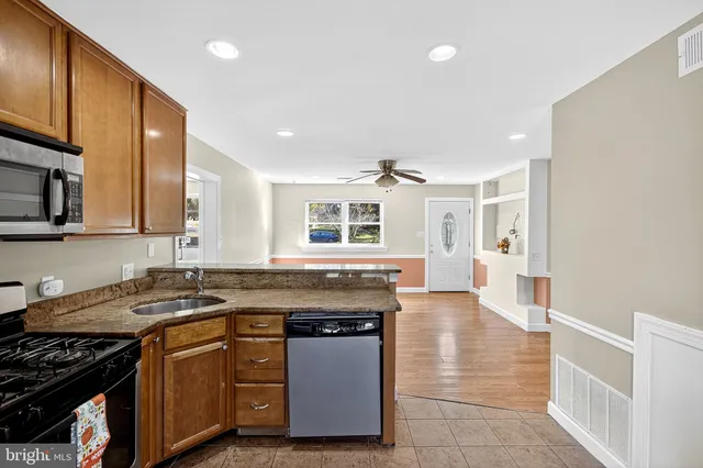 a kitchen with a stove and a sink