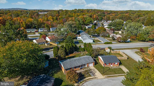 an outdoor living area with furniture and garden view