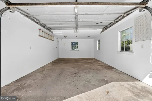 a view of empty room with windows