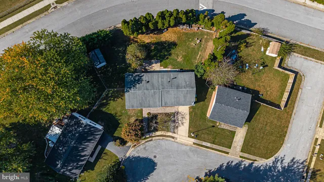an aerial view of a house with a garden