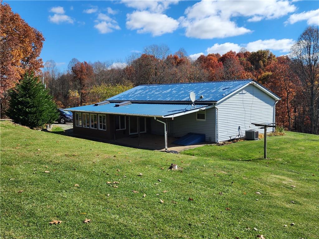 1047 Kettering Road Creekside, PA 15732 - Photo 3 of 24 a view of a house with backyard and garden