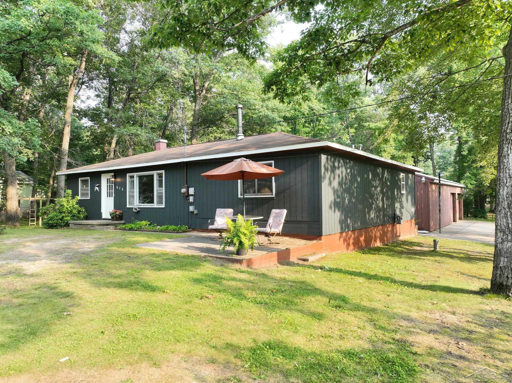 670 Lone Pine Road Harrison, MI 48625 - Photo 2 of 34 Property in the city is hard to find, especially when the lot is this large. Plenty of room for a pool, garden, animals, whatever you may need to add. Come make this home your own!