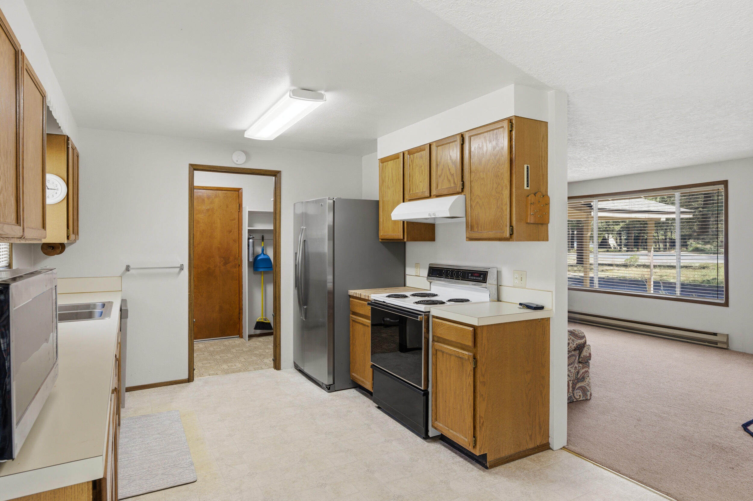 50868 Doe Loop La Pine, OR 97739 - Photo 14 of 51 a kitchen with a stove top oven and refrigerator