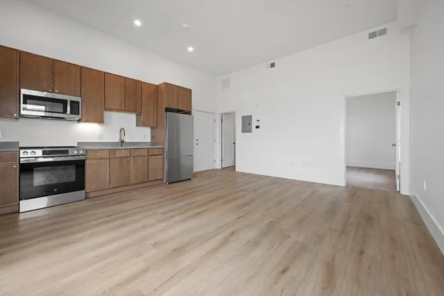 a view of kitchen with wooden floor