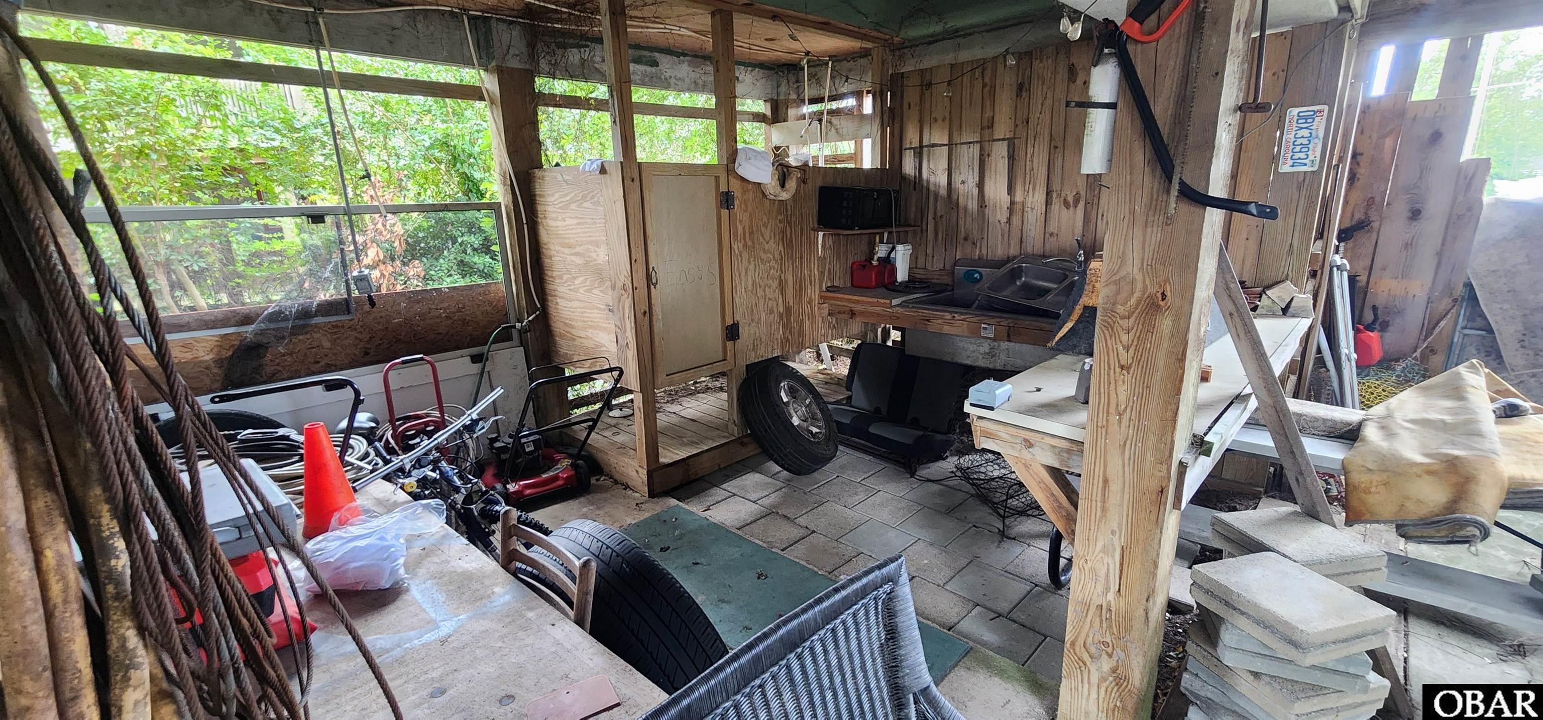 101 Inlet Court Kill Devil Hills, NC 27948 - Photo 23 of 37 Outdoor shower area and tiki zone