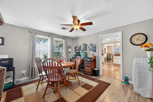 a view of a dining room with furniture window and wooden floor