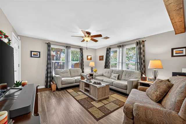 a living room with furniture and a large window