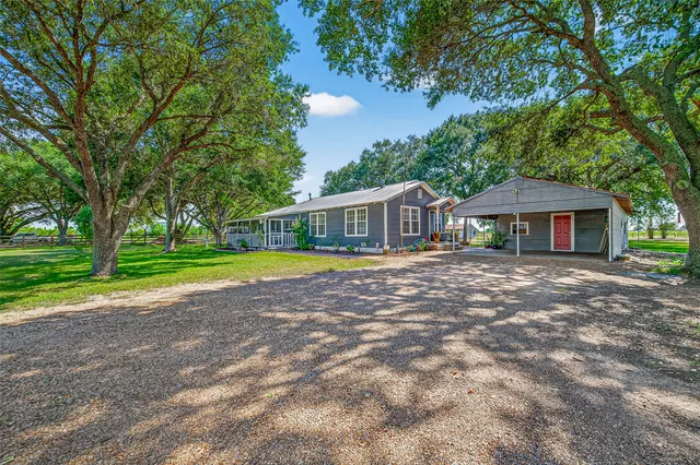 a house with swimming pool in front of it