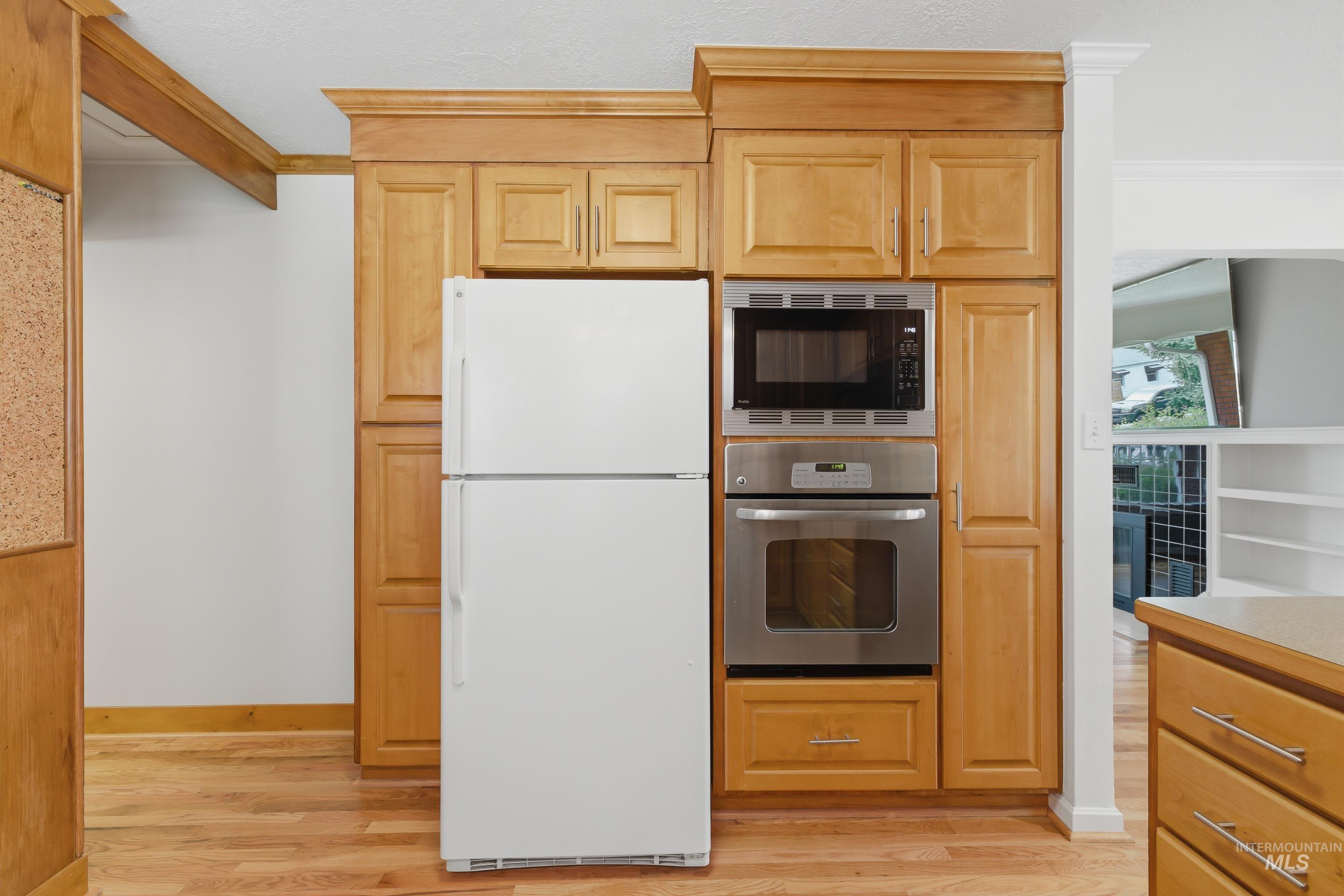 504 West Howe Street Boise, ID 83706 - Photo 20 of 47 Kitchen featuring wood-finish cabinetry and flooring