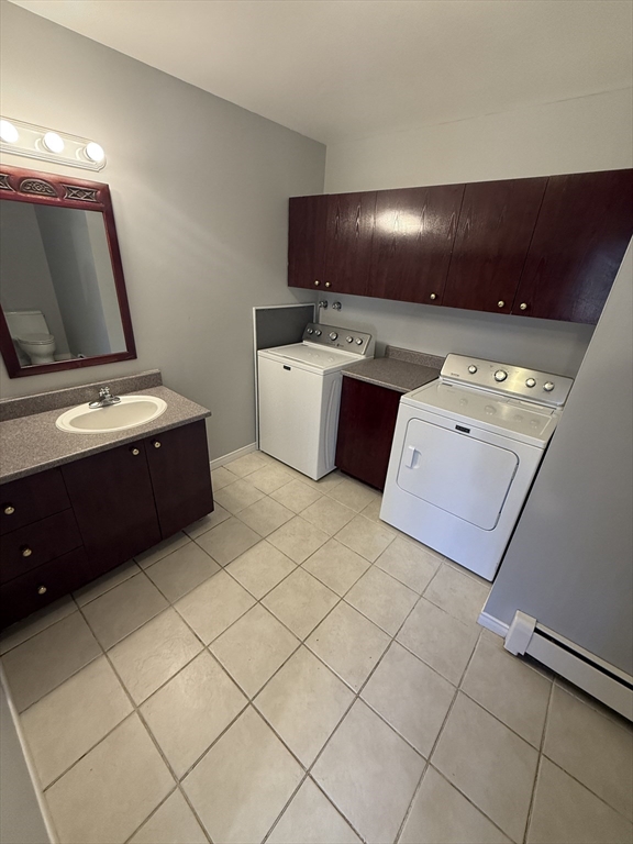 51 Forest Street, Unit 1 Lawrence, MA 01841 - Photo 8 of 8 a kitchen with a stove and cabinets