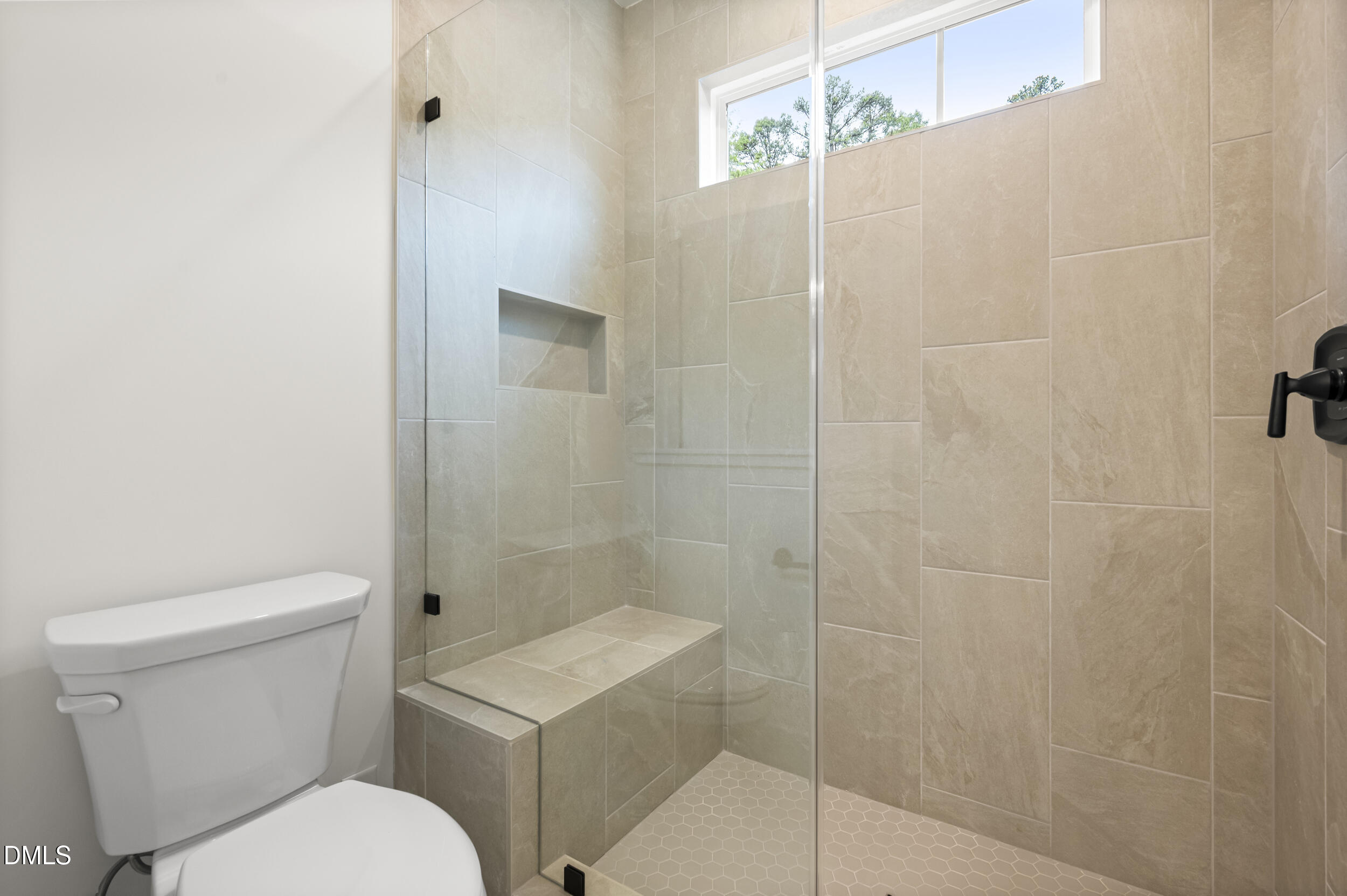 708 Grayhaven Place Raleigh, NC 27606 - Photo 17 of 33 a white toilet sitting next to a bathroom sink
