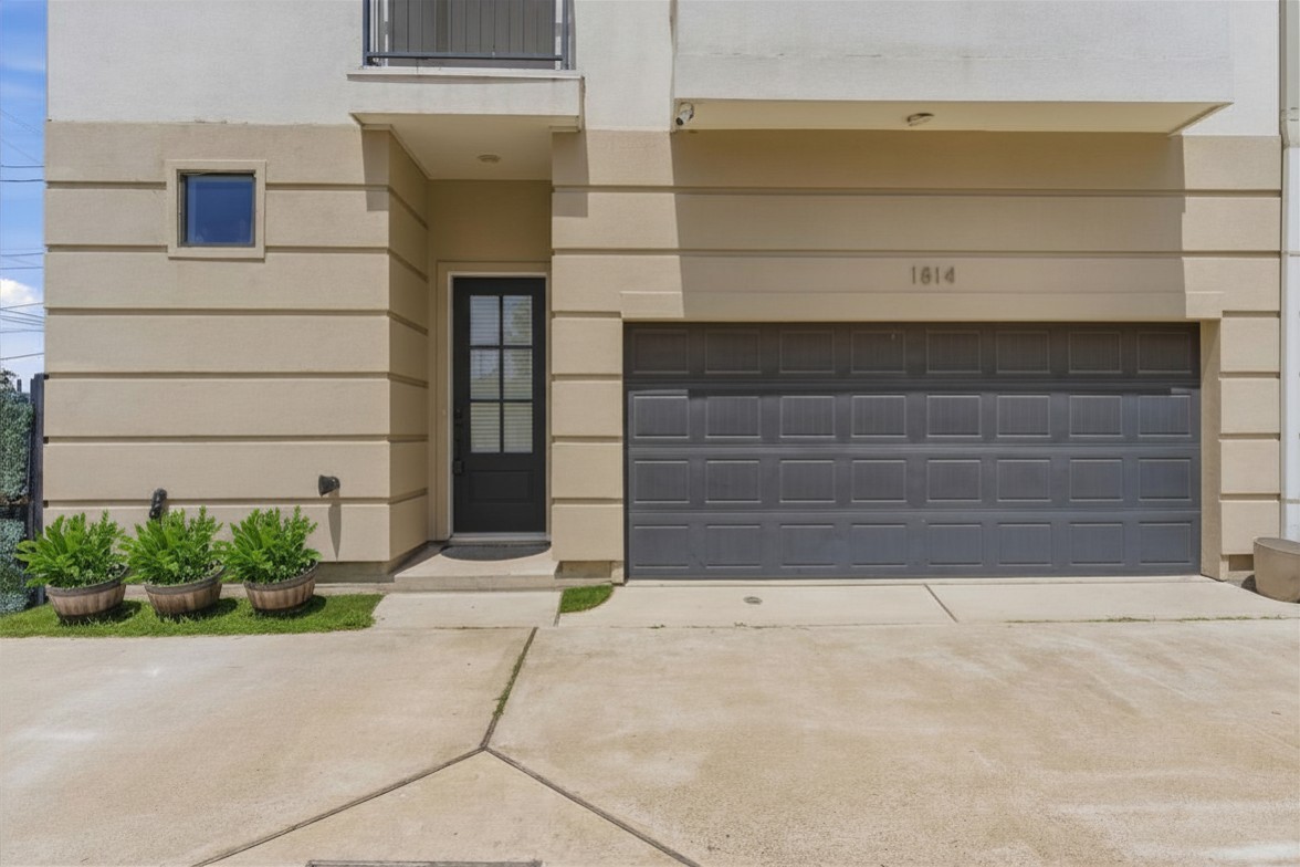 1814 Thompson Street Houston, TX 77007 - Photo 31 of 37 Modern three-story townhome featuring a crisp white exterior and a bright, spacious layout designed for comfortable contemporary living.