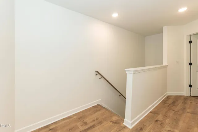 a kitchen with granite countertop white cabinets and stainless steel appliances