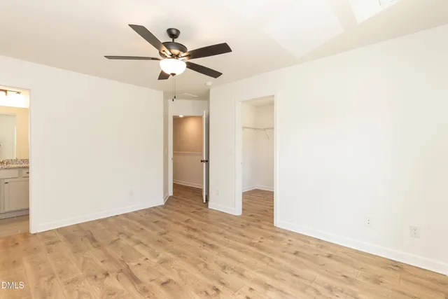 a kitchen with granite countertop a sink stove and microwave