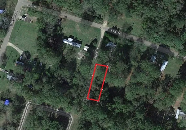 an aerial view of residential house with outdoor space and swimming pool