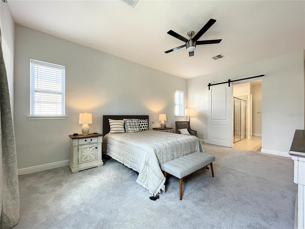 9062 Sperry Street Orlando, FL 32827 - Photo 17 of 44 a bedroom with a bed and window
