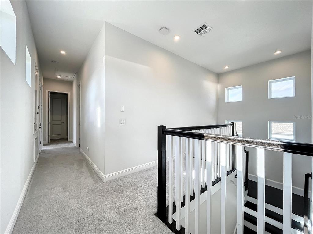 9062 Sperry Street Orlando, FL 32827 - Photo 23 of 44 a view of hallway with stairs