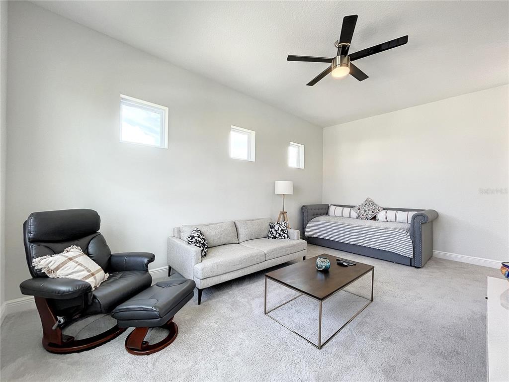 9062 Sperry Street Orlando, FL 32827 - Photo 25 of 44 a living room with furniture