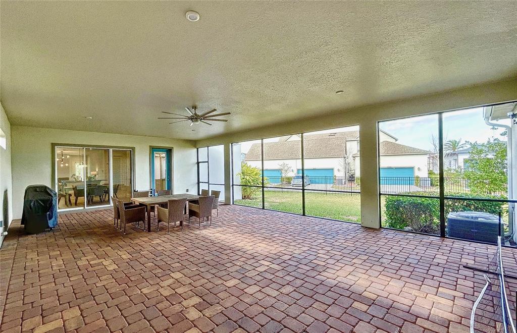 9062 Sperry Street Orlando, FL 32827 - Photo 38 of 44 a view of a house with backyard porch and sitting area