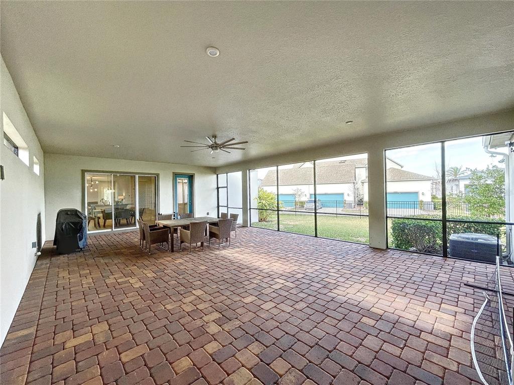 9062 Sperry Street Orlando, FL 32827 - Photo 40 of 44 a view of a house with backyard and sitting area