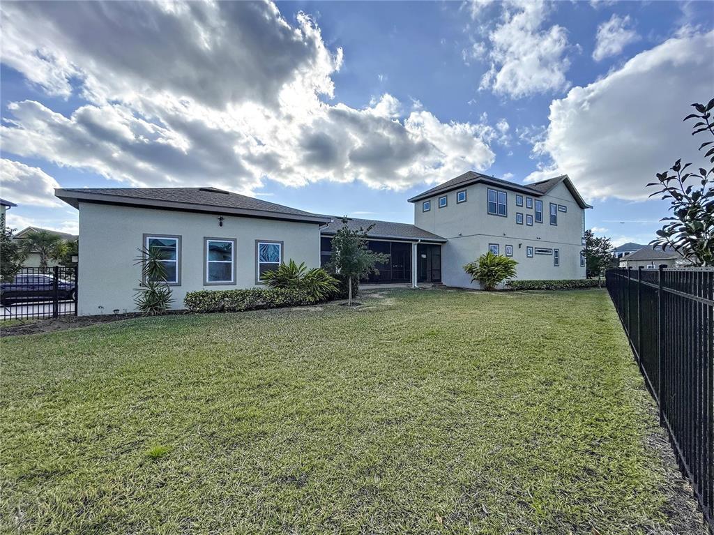 9062 Sperry Street Orlando, FL 32827 - Photo 41 of 44 a view of a house with a backyard