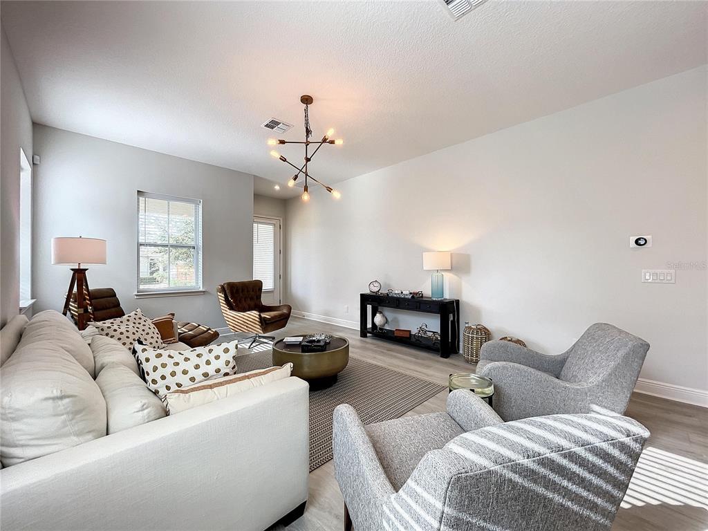9062 Sperry Street Orlando, FL 32827 - Photo 6 of 44 a living room with furniture