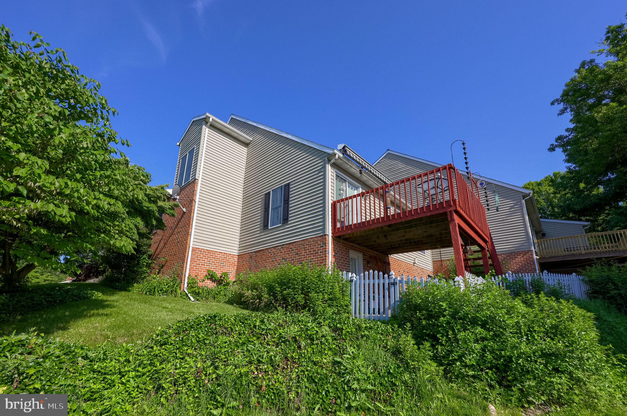 17 Georgetown Court Mountville, PA 17554 - Photo 3 of 32 Charming home with lush greenery backdrop.