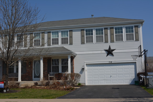 718 Wilson Street Waterman, IL 60556 - Photo 1 of 7 a view of house with yard