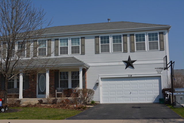 718 Wilson Street Waterman, IL 60556 - Photo 2 of 7 a view of house with yard