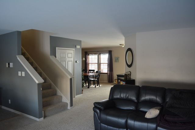 718 Wilson Street Waterman, IL 60556 - Photo 3 of 7 a living room with furniture and a large window
