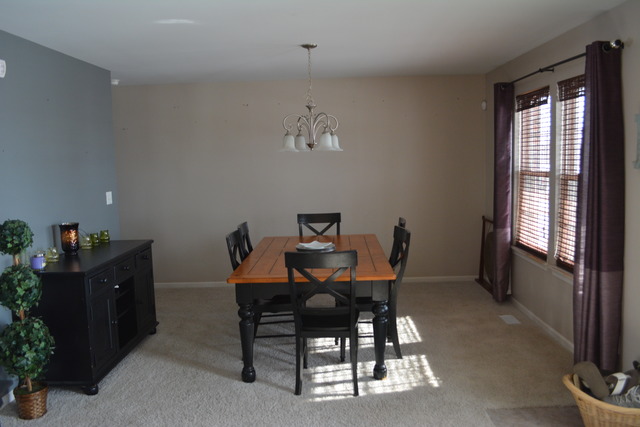 718 Wilson Street Waterman, IL 60556 - Photo 6 of 7 a view of a dining room with furniture and window