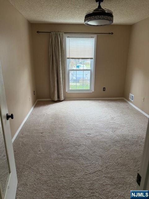 540 Holly Court Mahwah, NJ 07430 - Photo 1 of 5 an empty room with a fireplace and windows