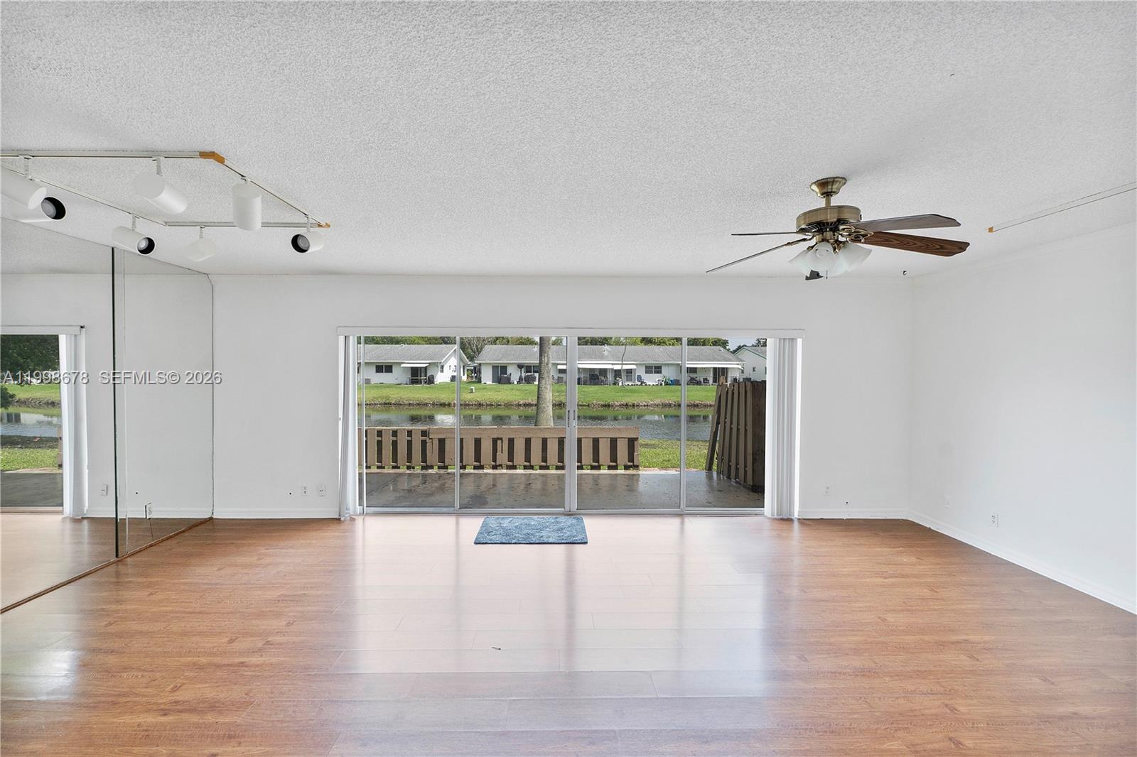 8243 Northwest 9th Street, Unit 7 Plantation, FL 33324 - Photo 2 of 30 a view of an empty room with a window