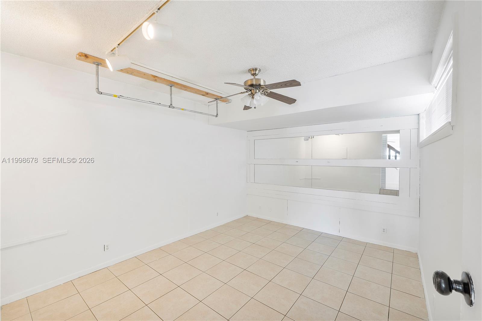 8243 Northwest 9th Street, Unit 7 Plantation, FL 33324 - Photo 21 of 30 a view of a room with racks on the wall