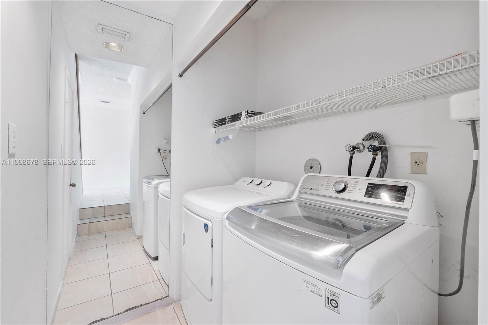 8243 Northwest 9th Street, Unit 7 Plantation, FL 33324 - Photo 22 of 30 a utility room with dryer and washer